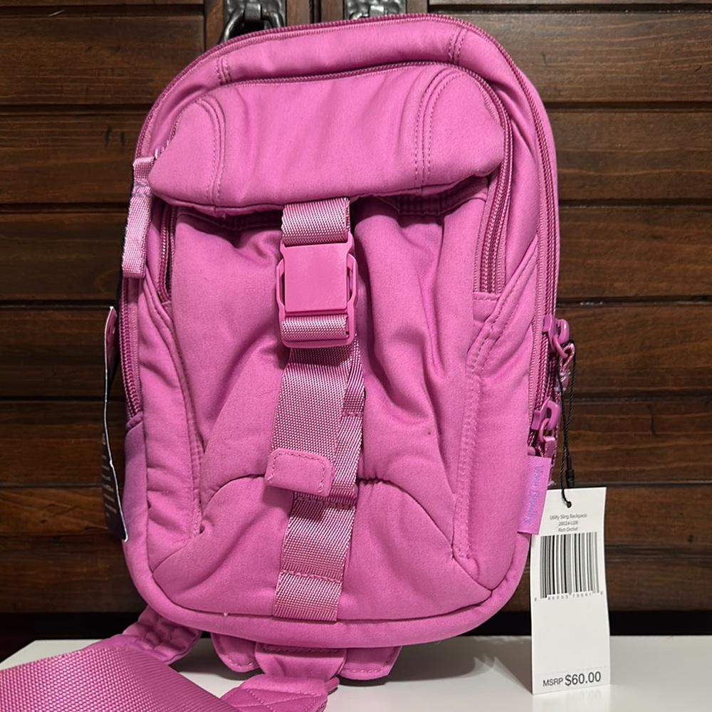 Pink Sling Backpack with Buckle Closure